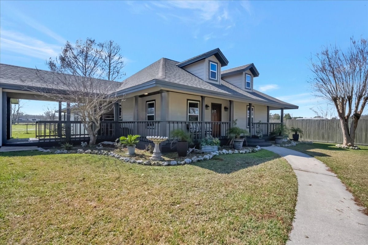 12335 2nd Street Santa Fe, TX 77539 - Photo 7 of 49 a view of a house with backyard sitting area and garden