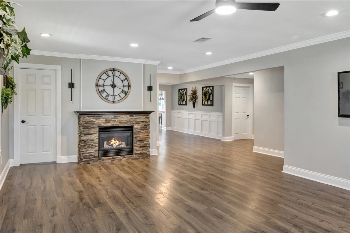 12335 2nd Street Santa Fe, TX 77539 - Photo 10 of 49 a view of a livingroom with a fireplace wooden floor and a window