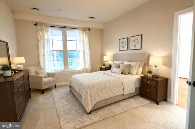 a bedroom with a bed and a couch