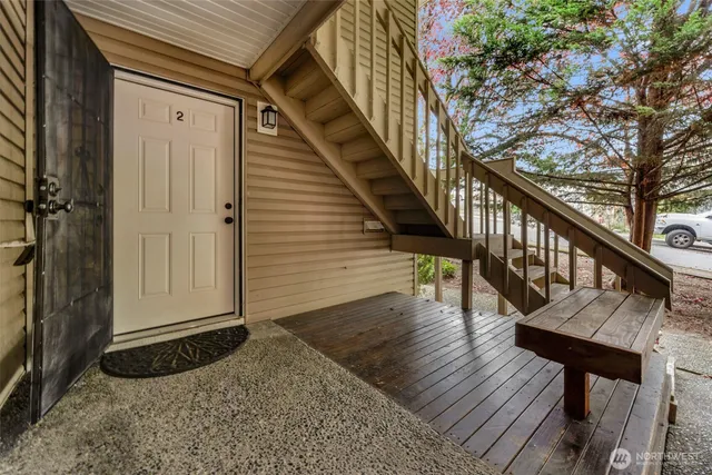 a balcony with wooden floor