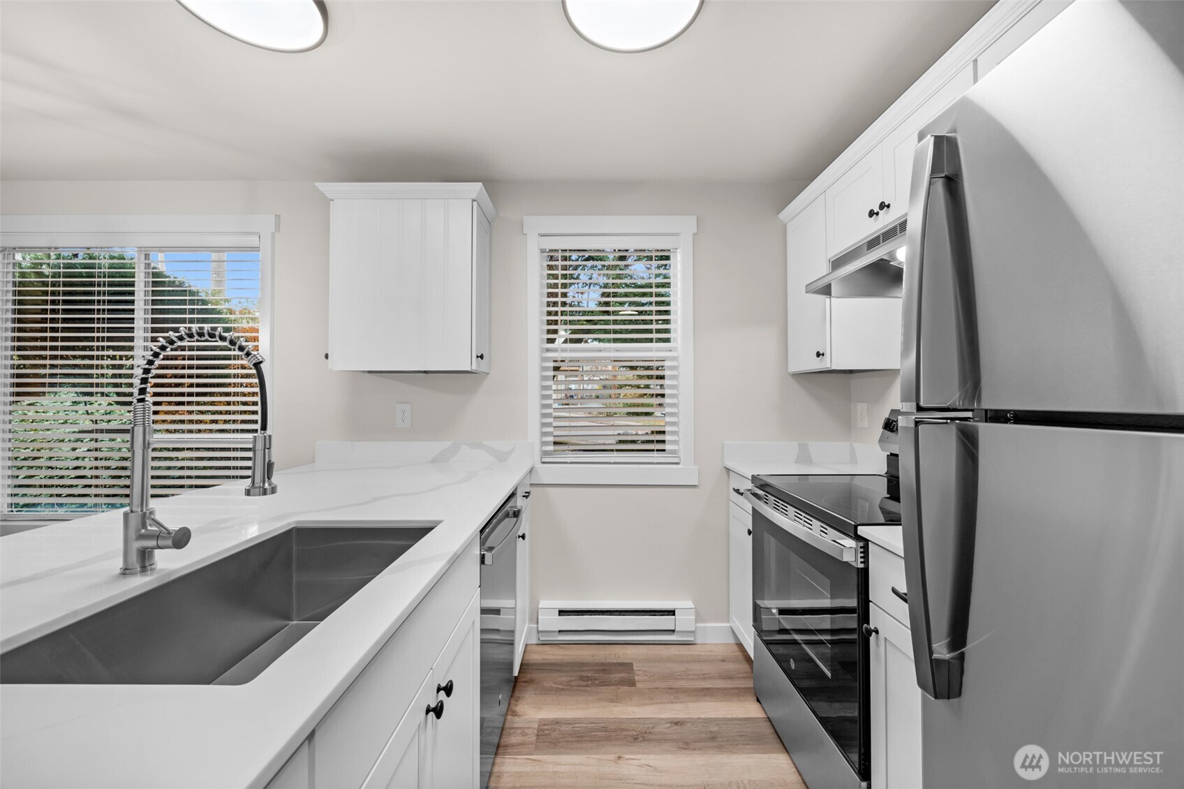 1302 Chestnut Street, Unit 2 Everett, WA 98201 - Photo 2 of 31 a kitchen with stainless steel appliances granite countertop a sink stove and refrigerator