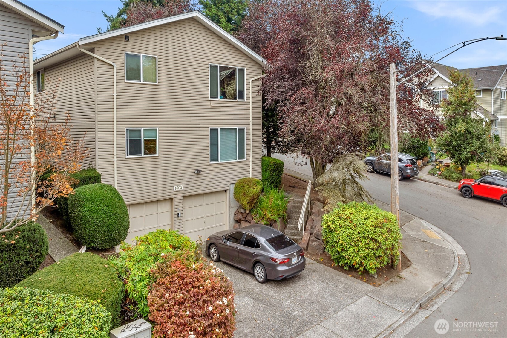 1302 Chestnut Street, Unit 2 Everett, WA 98201 - Photo 23 of 31 a front view of a house with a garden