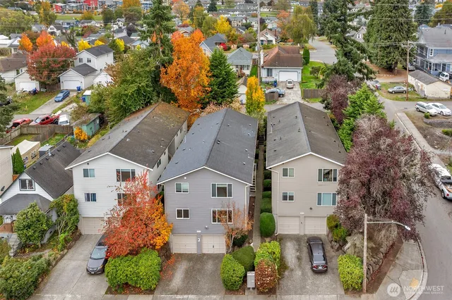 an aerial view of a house with a yard