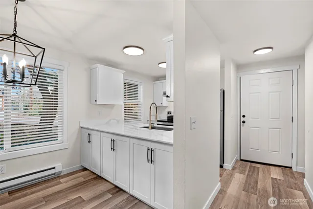 a kitchen with a sink and cabinets