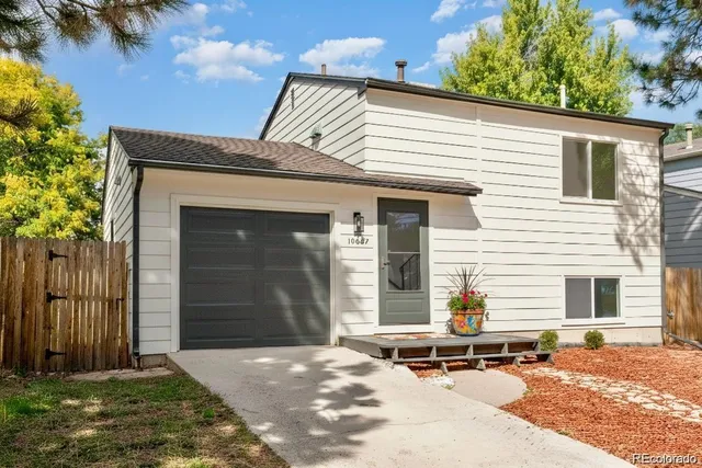 a backyard of a house with yard and garage