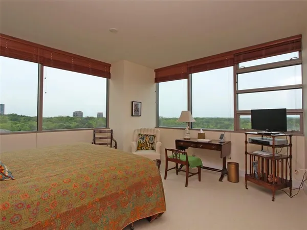 a living room with chairs and a flat screen tv