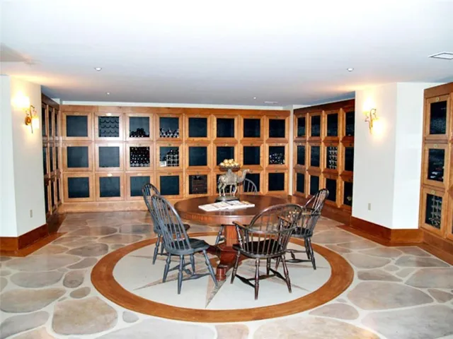 a dining room with furniture a rug and wooden floor