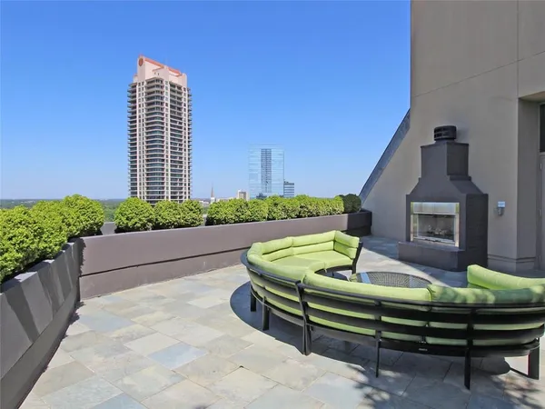 a front view of a house with outdoor seating