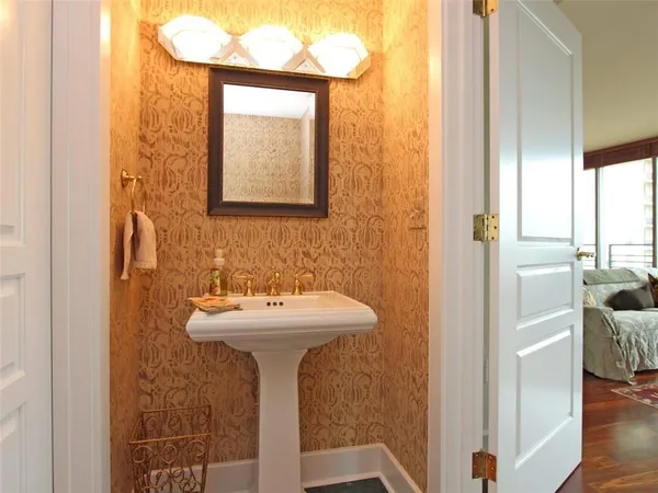a bathroom with a sink and mirror