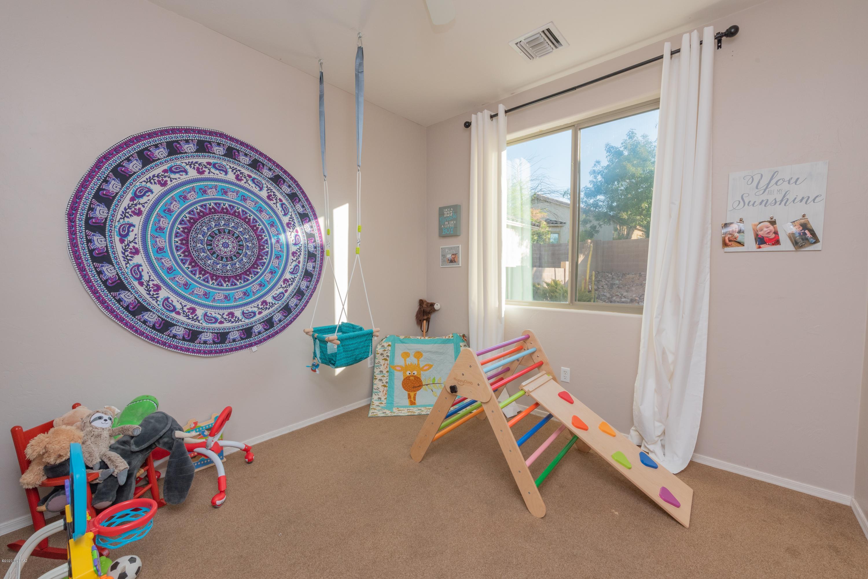12910 Bloomington Loop Oro Valley, AZ 85755 - Photo 13 of 30 a very nice looking room with a large window