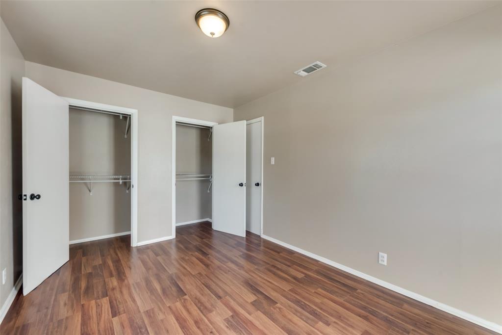 336 Shoreline Drive Azle, TX 76020 - Photo 12 of 20 a view of an empty room with wooden floor