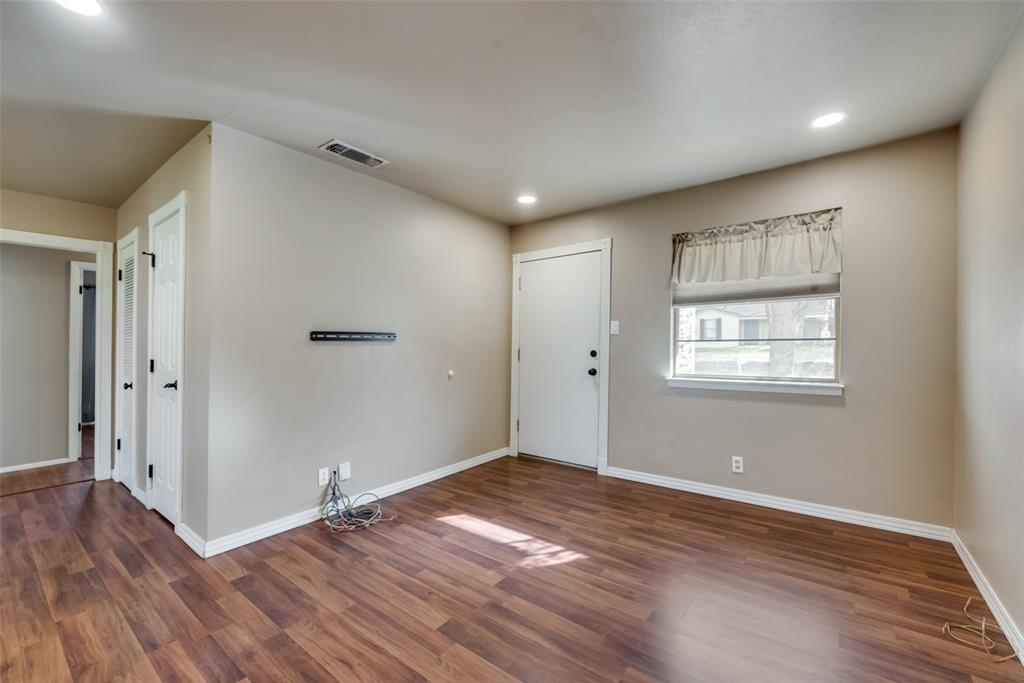 336 Shoreline Drive Azle, TX 76020 - Photo 5 of 20 an empty room with wooden floor and windows