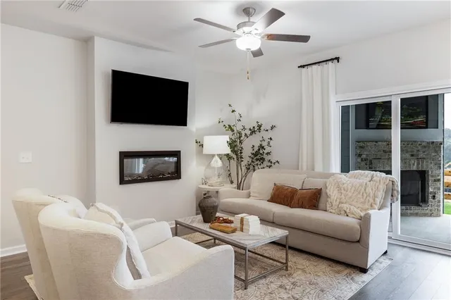 a living room with furniture fireplace and a flat screen tv
