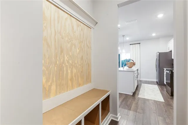 a view of kitchen with furniture and wooden floor