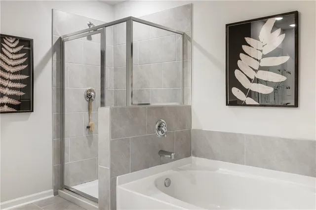a bathroom with a bathtub and shower