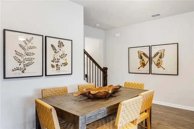 a view of a dining area with furniture and wooden floor