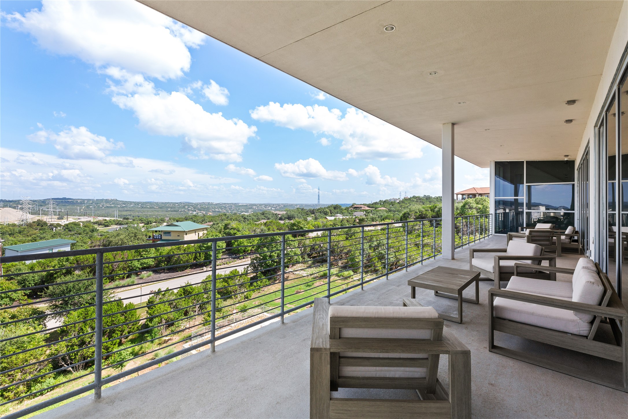 4229 Ranch Road 620 North, Unit 217 Austin, TX 78734 - Photo 11 of 17 a balcony with furniture and city view
