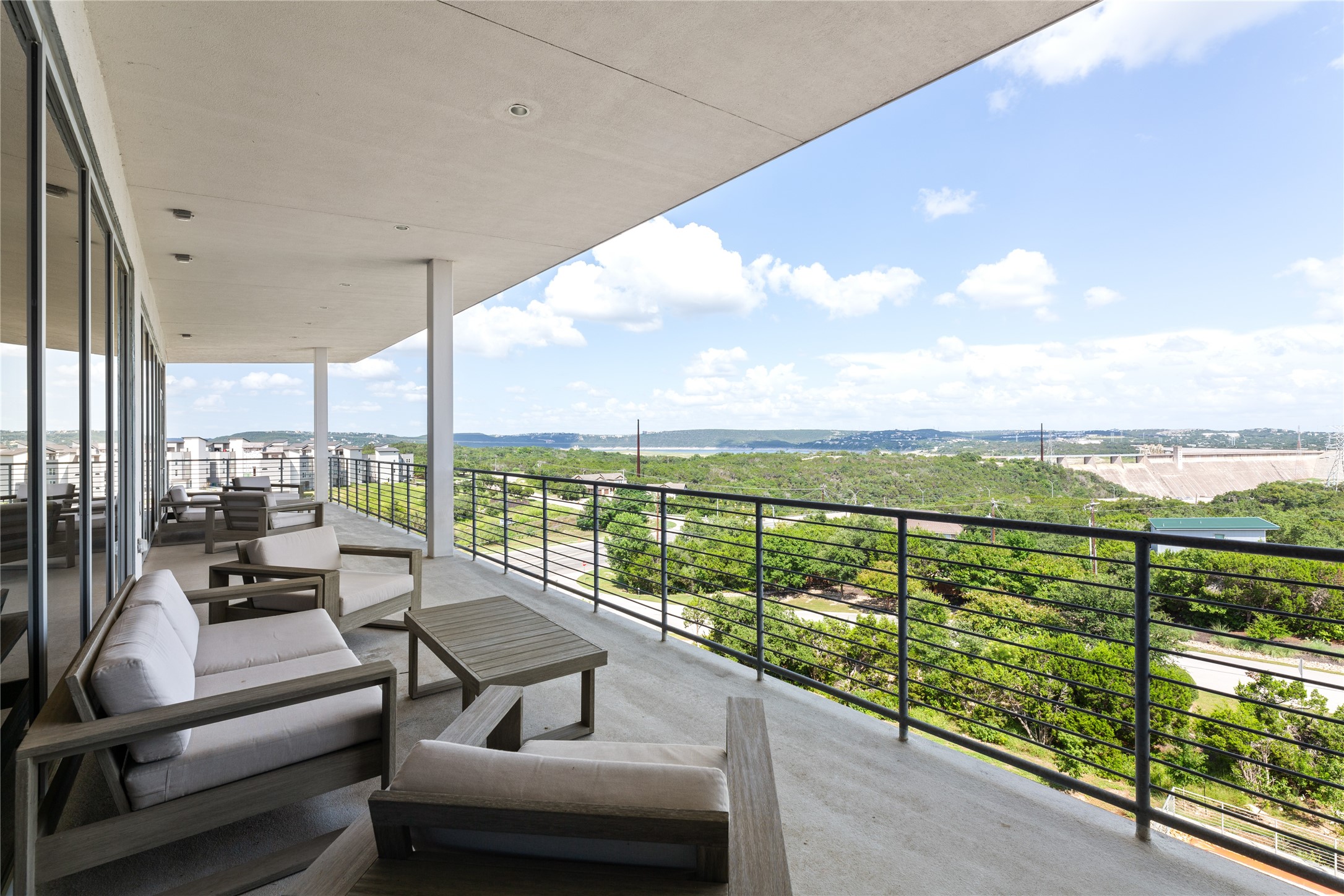 4229 Ranch Road 620 North, Unit 217 Austin, TX 78734 - Photo 12 of 17 a balcony with furniture and city view