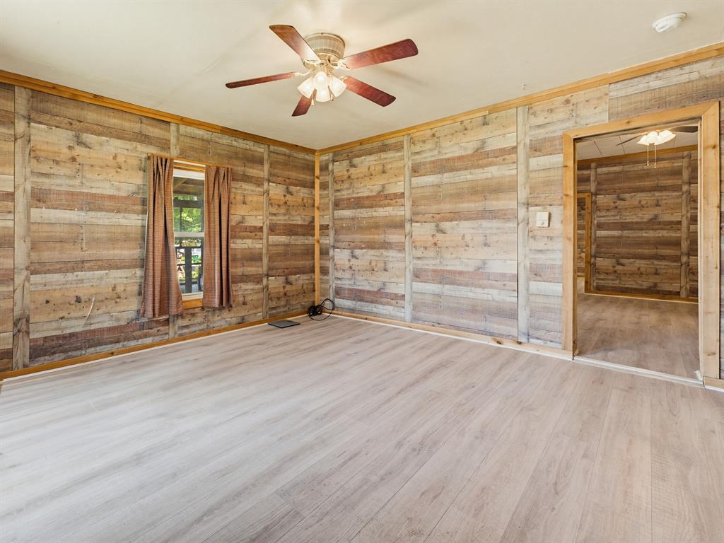 601 South Miller Street Decatur, TX 76234 - Photo 14 of 36 wooden floor in an empty room with a window