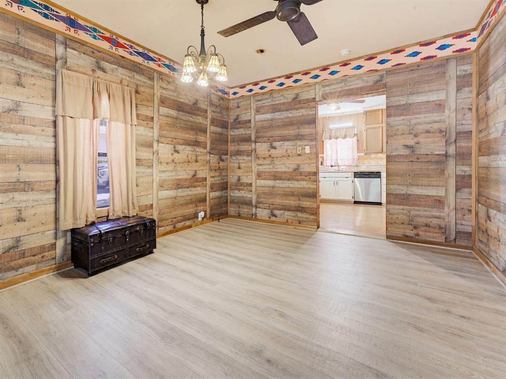 601 South Miller Street Decatur, TX 76234 - Photo 17 of 36 a room with wooden floor and furniture