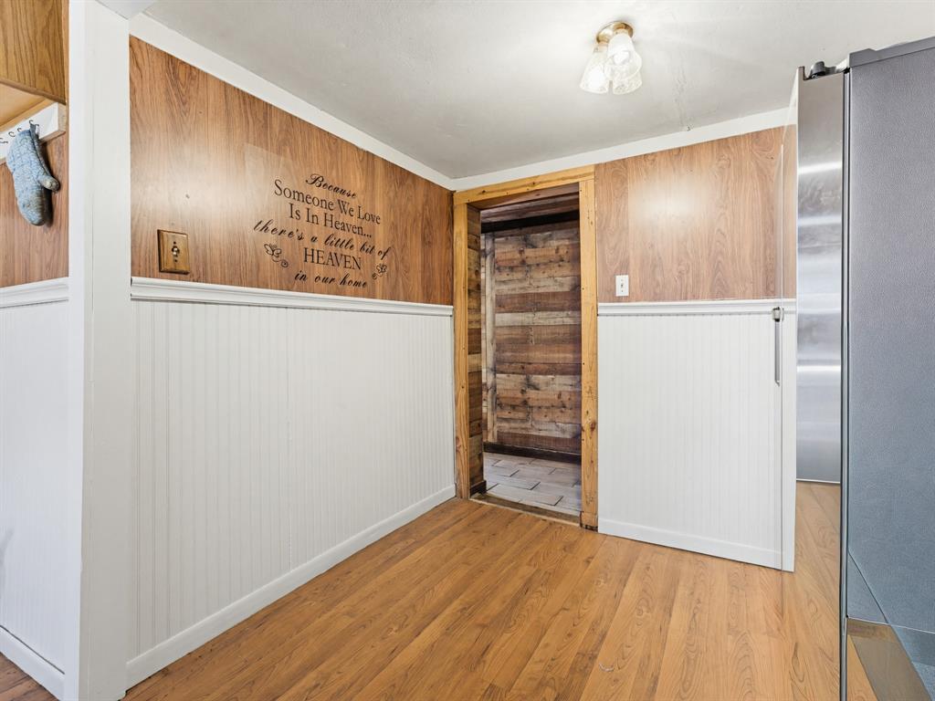 601 South Miller Street Decatur, TX 76234 - Photo 28 of 36 a view of a hallway with wooden floor and a cabinet