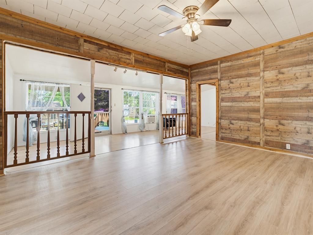 601 South Miller Street Decatur, TX 76234 - Photo 10 of 36 wooden floor in an empty room with a window