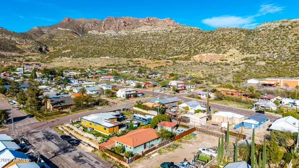 a living room with furniture a rug and a lamp
