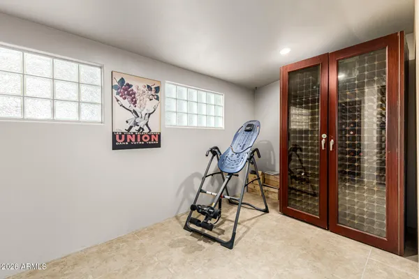 a kitchen with kitchen island granite countertop a sink stainless steel appliances and cabinets
