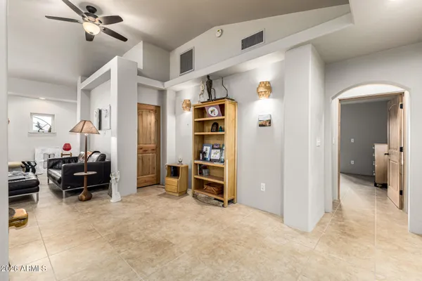 a bedroom with a bed and a lamp