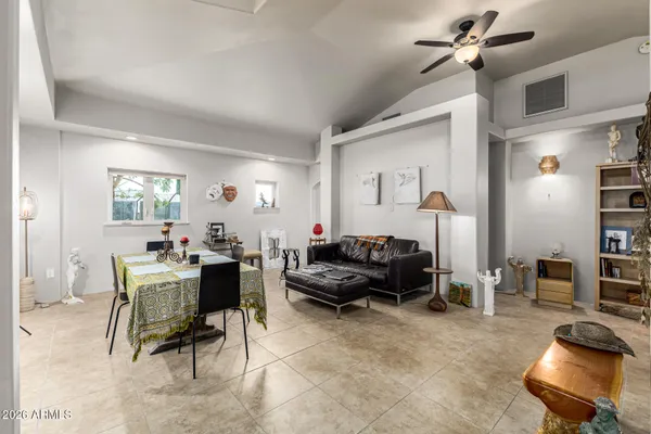 a bathroom with a shower a toilet and a sink