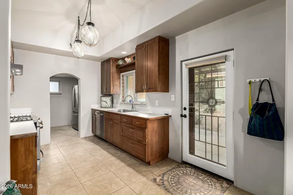 a view of a livingroom with a table and chairs