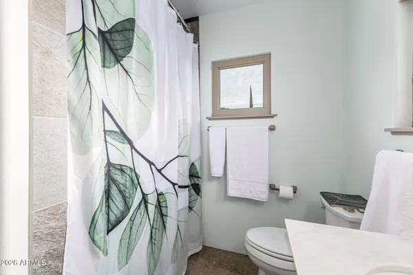 an aerial view of a houses with yard