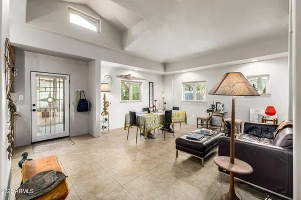 a bathroom with a granite countertop sink mirror vanity and toilet