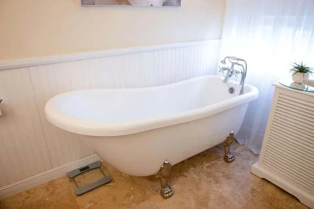 a bathroom with a shower and a sink