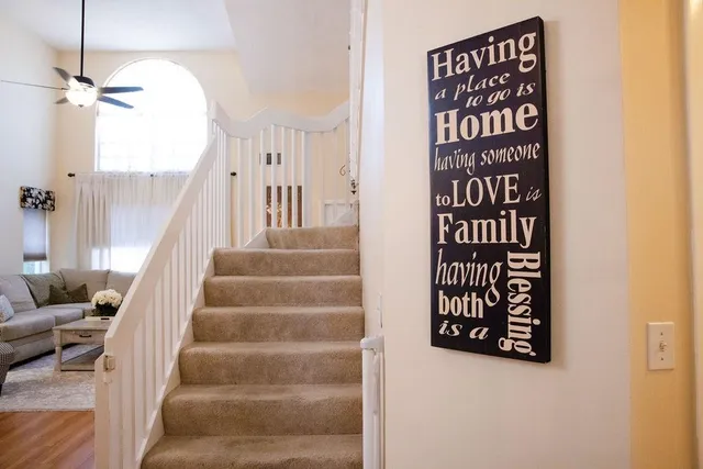 a bedroom with a bed and a wall painting