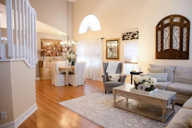 a living room with furniture fireplace and rug