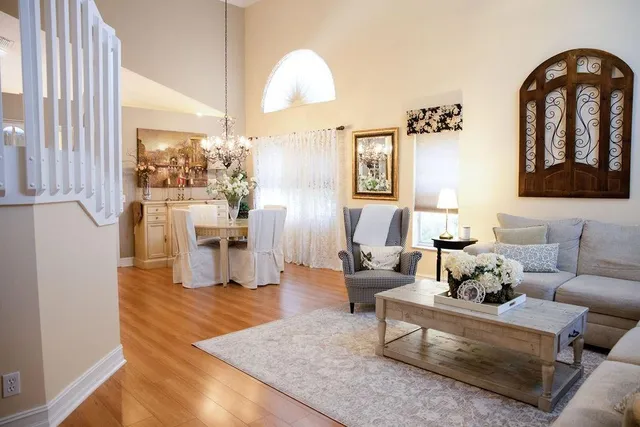a living room with furniture fireplace and rug
