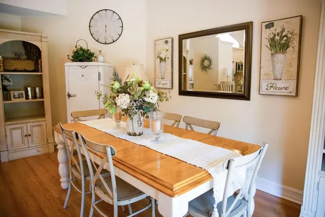 a view of a dining room with furniture and wooden floor