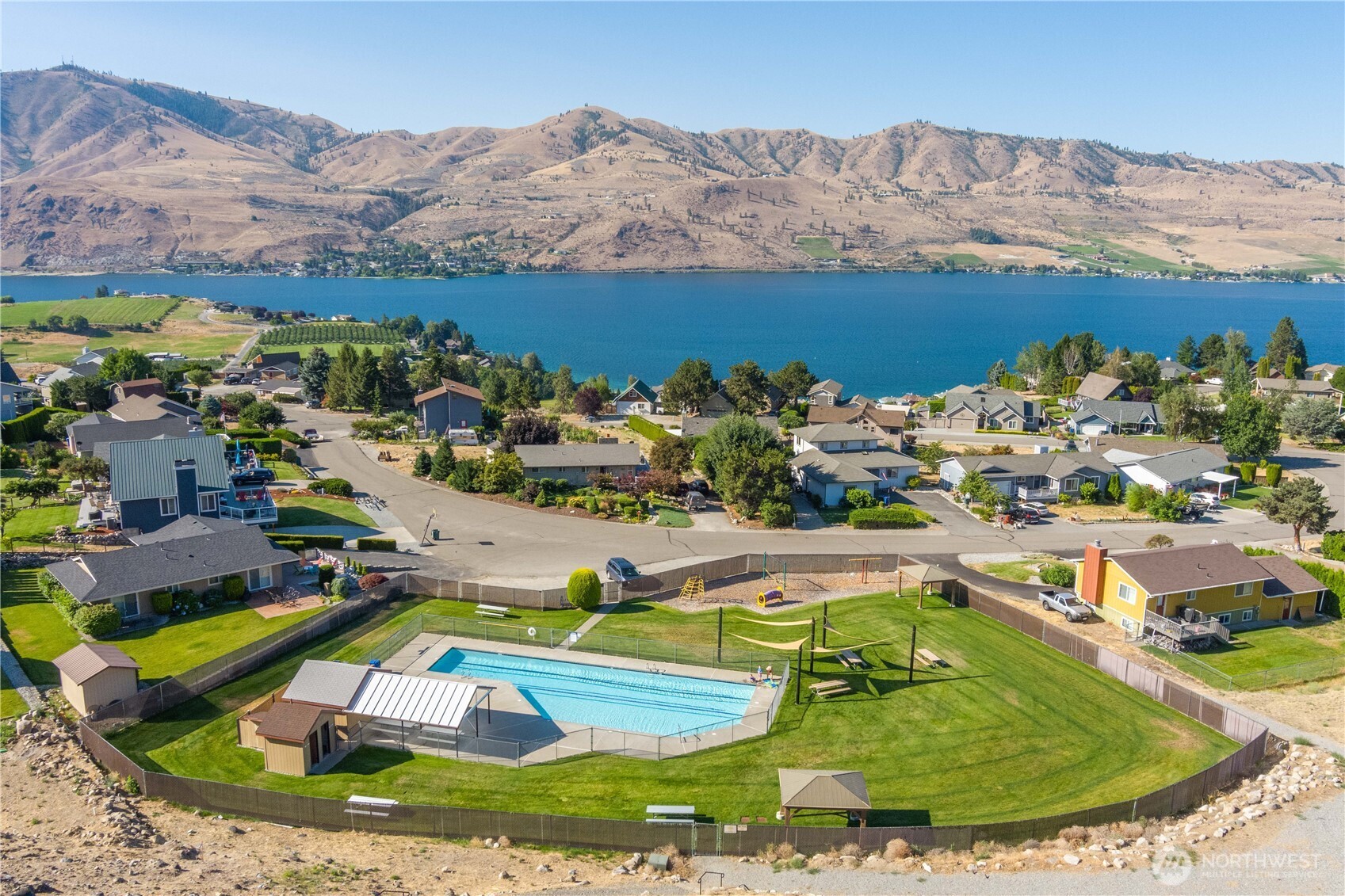 122 Lookout Way Chelan, WA 98816 - Photo 38 of 40 a view of a house with a yard and mountain