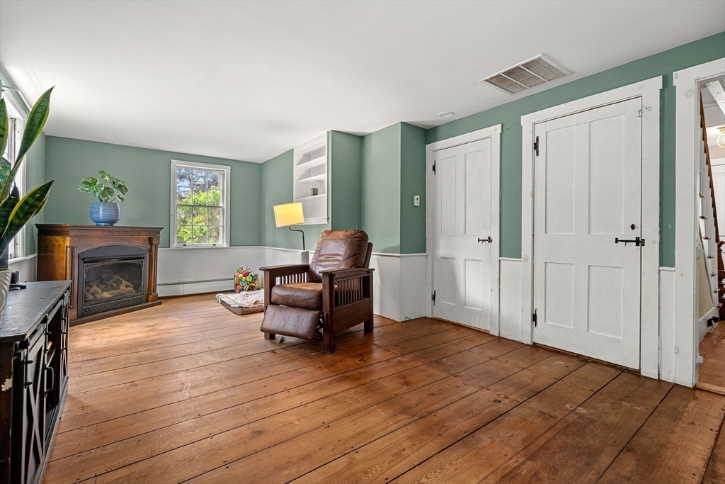 600 Main Street Ashby, MA 01431 - Photo 14 of 40 a living room with furniture and a fireplace