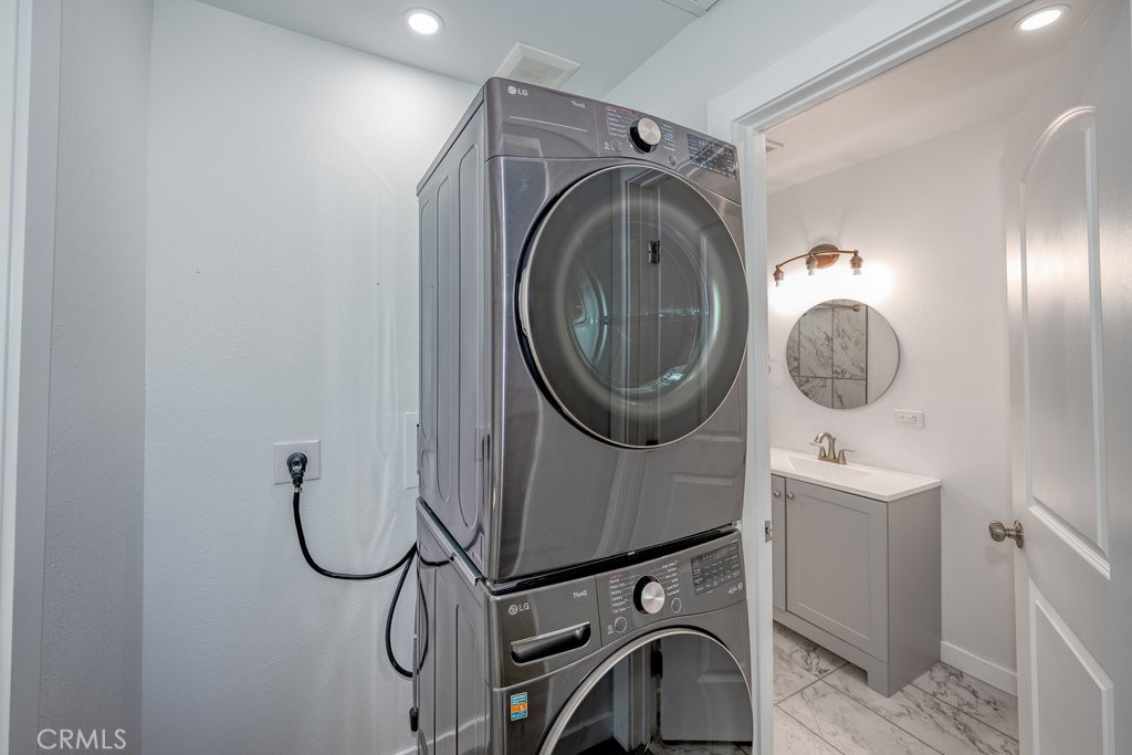 1069 Erringer Road, Unit 1 Simi Valley, CA 93065 - Photo 7 of 8 a bathroom with a sink mirror vanity and toilet