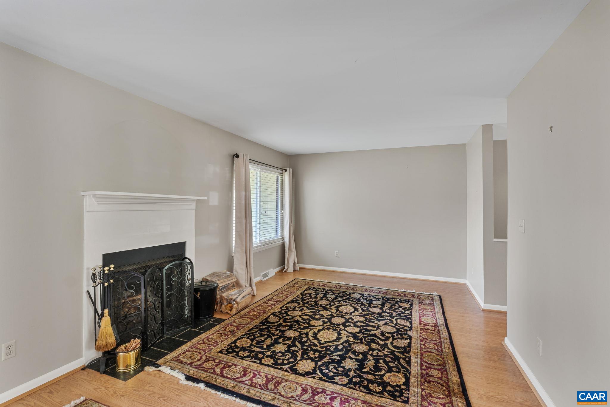 1212 Chatham Ridge Charlottesville, VA 22901 - Photo 11 of 17 a view of a livingroom with wooden floor and a rug