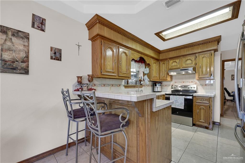 1607 West Main Street Rio Grande City, TX 78582 - Photo 11 of 31 a kitchen with a table and chairs in it