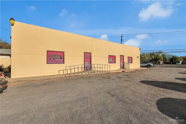 a view of parking space and parked car