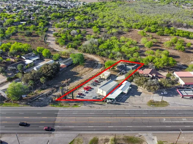 a bathroom with a bathtub sink and mirror