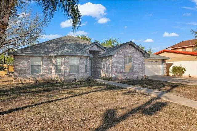 a bathroom with a sink a toilet and shower curtain