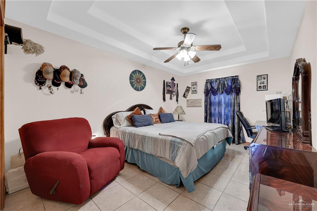 1607 West Main Street Rio Grande City, TX 78582 - Photo 8 of 31 a bedroom with bed and a couch