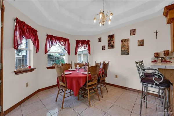 a kitchen with a table and chairs in it