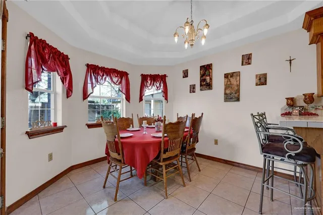 a kitchen with a table and chairs in it