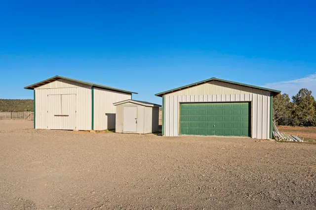 a view of a house with a yard and garage